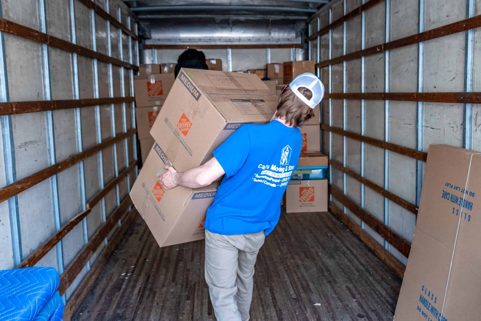 Cal's Moving team carefully loading furniture during a Central Oregon move