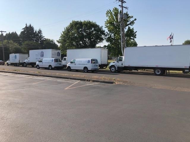 Cal's trucks parked on the street near the National Guard building in Corvallis